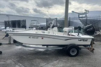 Slide: The Image of 2022 Mako Pro Skiff 15 CC boat on trailer, parked outdoors. - 5