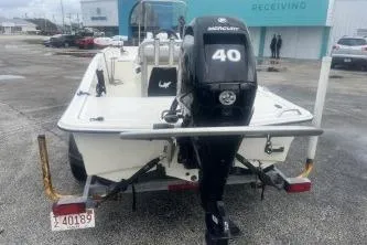 Slide: The Image of 2022 Mako Pro Skiff 15 CC with Mercury 40 engine, parked outdoors. - 6