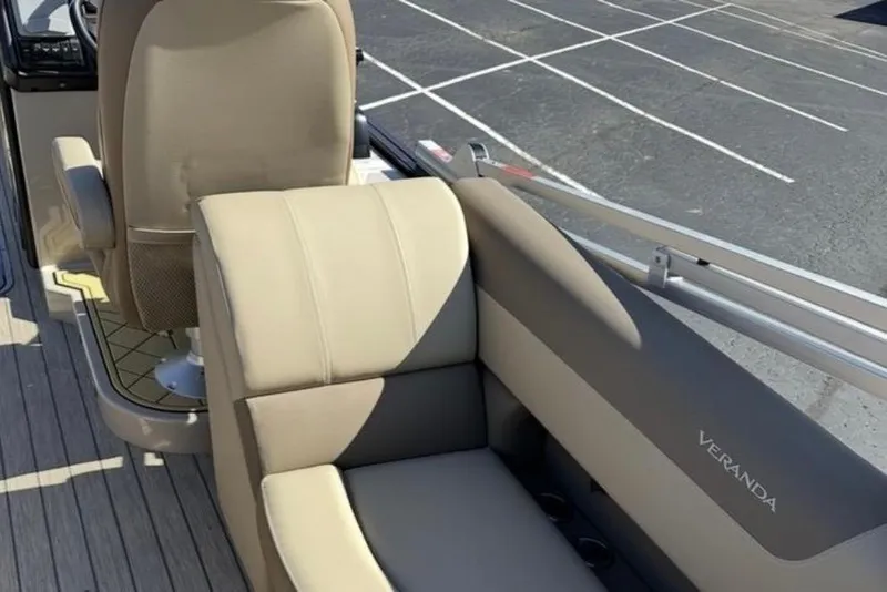 Slide: The Image of 2025 Veranda Relax VR 22 RC boat interior with beige seating and steering area. - 7