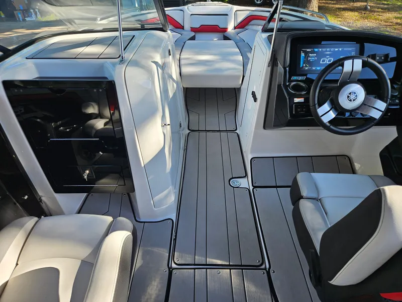 Slide: The Image of 2020 Yamaha Boats 242X interior with modern dashboard and seating. - 10