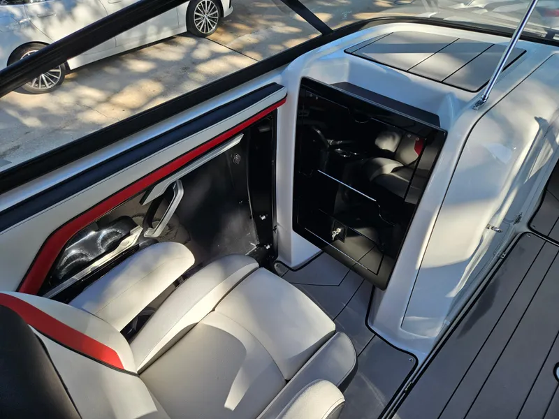 Slide: The Image of Interior of a 2020 Yamaha Boats 242X, featuring seating and storage compartments. - 9