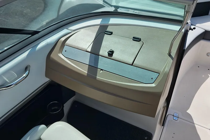 Slide: The Image of 2014 Regal 2100 Bowrider dashboard and glove compartment. - 12