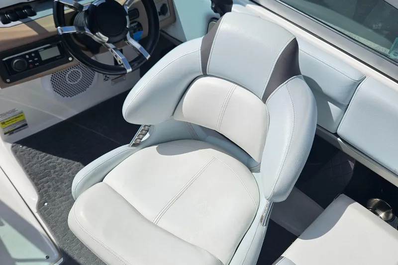 Slide: The Image of 2014 Regal 2100 Bowrider captain's seat and steering wheel. - 13