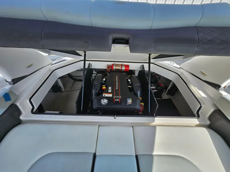 Slide: The Image of 2014 Regal 2100 Bowrider boat engine compartment with open hatch. - 7