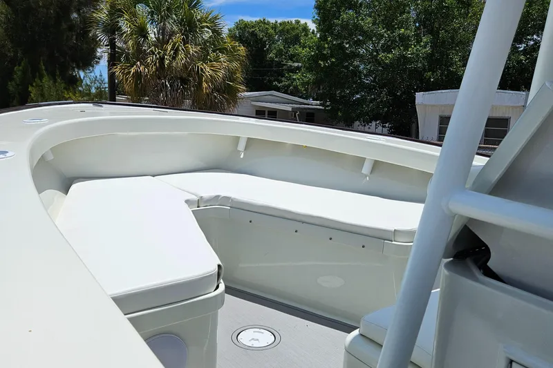 Slide: The Image of 2023 Carolina Classic 25 boat with spacious seating area and modern design. - 14