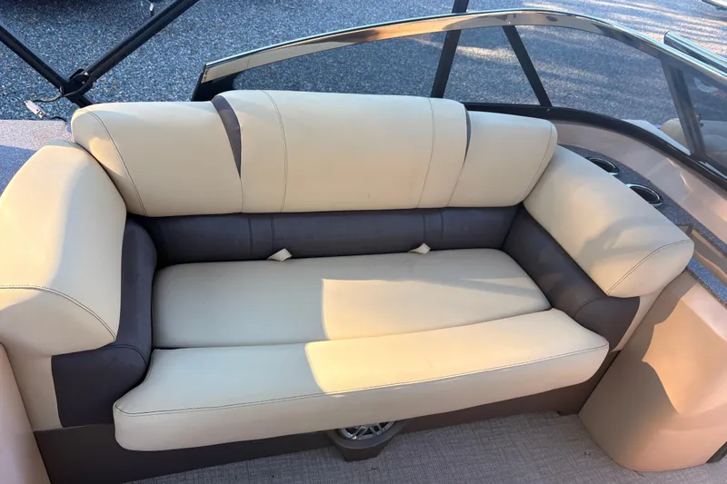 Slide: The Image of Luxurious seating on 2022 Avalon Excalibur Elite Windshield 27' boat, featuring beige and gray upholstery. - 12
