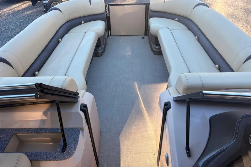 Slide: The Image of Interior of 2022 Avalon Excalibur Elite Windshield boat with spacious seating arrangement. - 13
