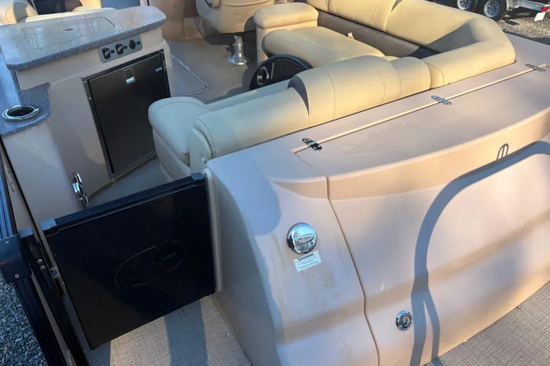 Slide: The Image of Luxurious interior of 2022 Avalon Excalibur Elite Windshield boat with plush seating. - 7