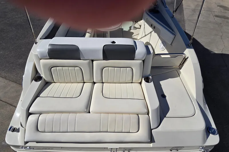 Slide: The Image of 2010 Sea Ray 260 Sundeck boat with spacious seating and sleek design. - 18