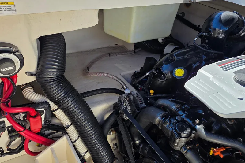 Slide: The Image of Engine compartment of a 2010 Sea Ray 260 Sundeck boat, showing various components and wiring. - 45