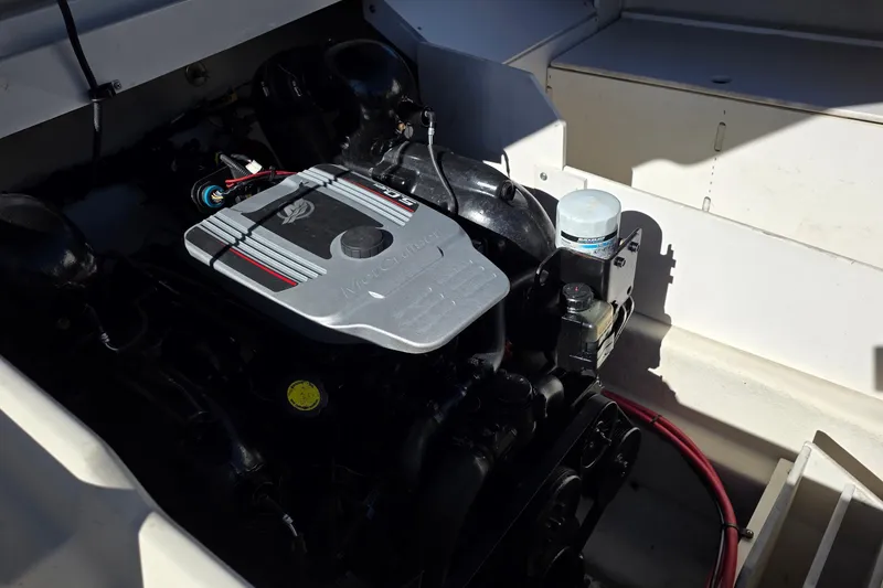 Slide: The Image of Engine compartment of a 2010 Sea Ray 260 Sundeck boat, featuring a MerCruiser engine. - 53
