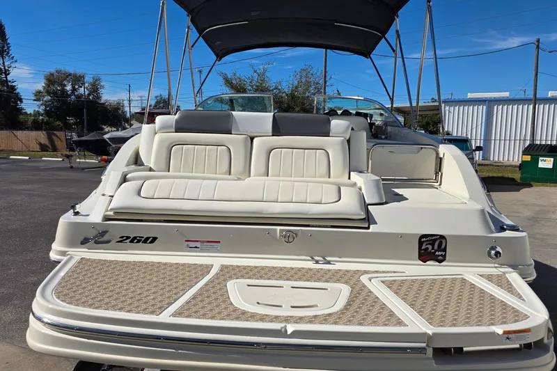 Slide: The Image of 2010 Sea Ray 260 Sundeck boat with spacious seating and swim platform. - 58