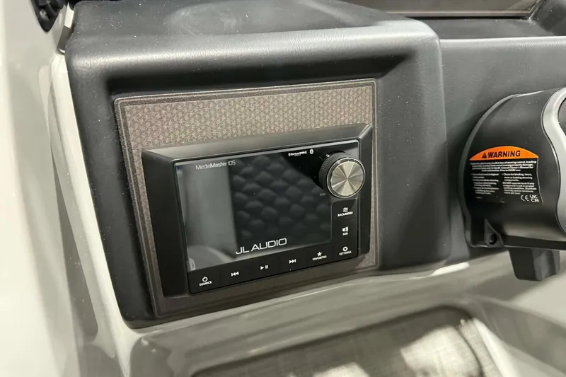 Slide: The Image of 2026 Manitou Encore SL 230 SHP dashboard featuring JL Audio MediaMaster 105 system. - 12