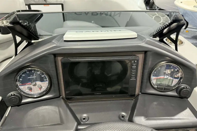 Slide: The Image of Dashboard of 2026 Manitou Encore SL 230 SHP with Garmin display and gauges. - 14