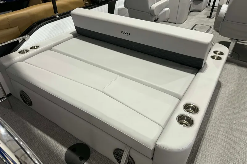 Slide: The Image of Luxurious seating on 2026 Manitou Encore SL 230 SHP pontoon boat with cup holders. - 19