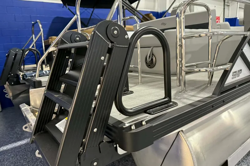 Slide: The Image of 2026 Manitou Encore SL 230 SHP pontoon boat with sleek ladder and seating. - 20