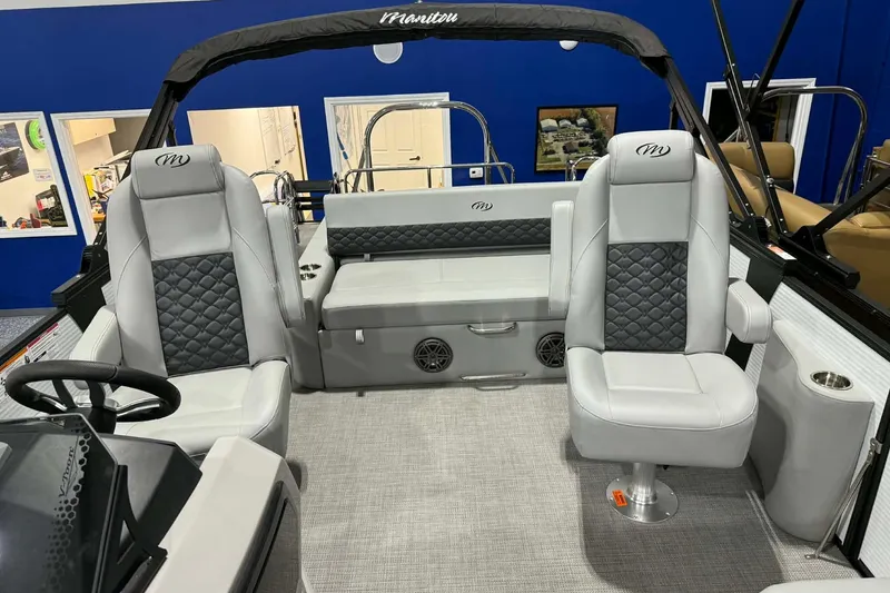 Slide: The Image of 2026 Manitou Encore SL 230 SHP boat interior with luxurious seating and modern design. - 7
