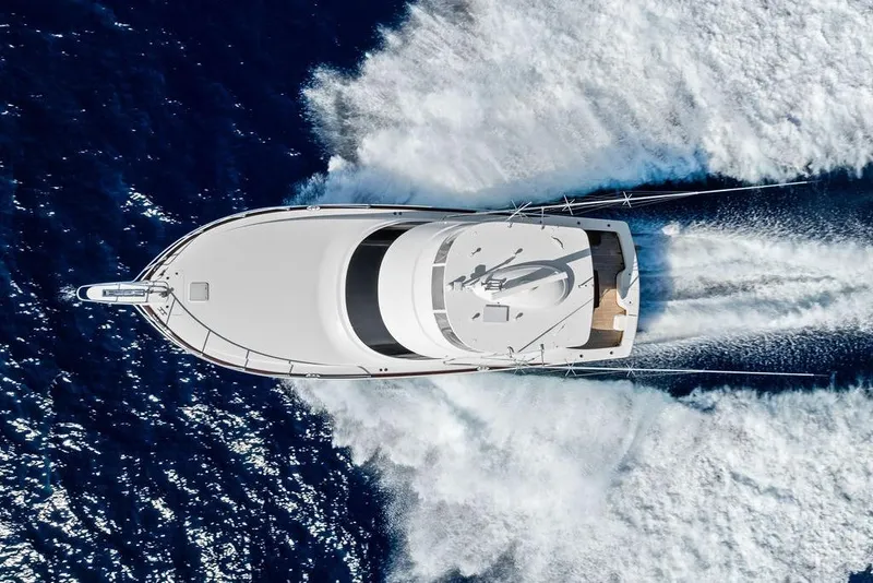 Slide: The Image of Aerial view of 2022 Viking 48 Convertible yacht cruising on open sea. - 16