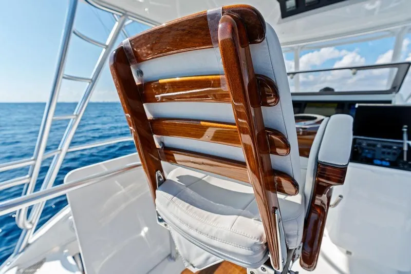 Slide: The Image of Captain's chair on 2022 Viking 48 Convertible yacht, overlooking ocean. - 20