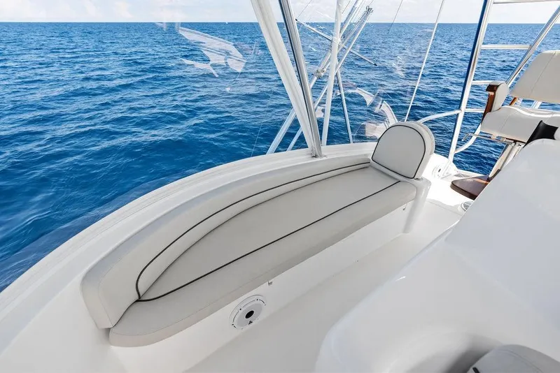 Slide: The Image of Luxurious seating on 2022 Viking 48 Convertible yacht overlooking the ocean. - 24