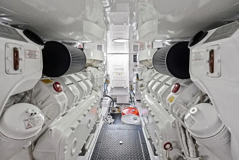 Slide: The Image of Engine room of 2022 Viking 48 Convertible yacht, featuring dual MAN engines. - 63