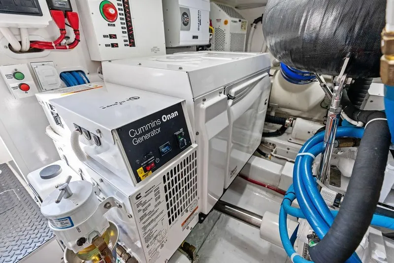 Slide: The Image of Engine room of 2022 Viking 48 Convertible with Cummins Onan generator. - 66