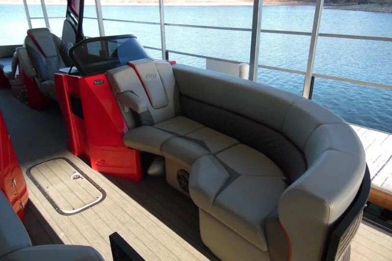 Slide: The Image of 2023 Manitou 25 XT RFX pontoon boat interior with luxurious seating and modern design. - 10