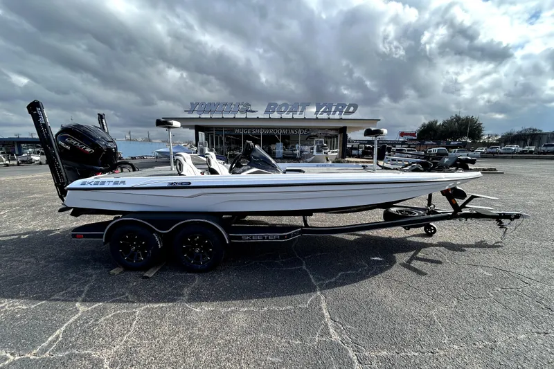The Image of 2026 Skeeter ZXE20 boat on trailer at Yowell's Boat Yard under cloudy sky. - 0