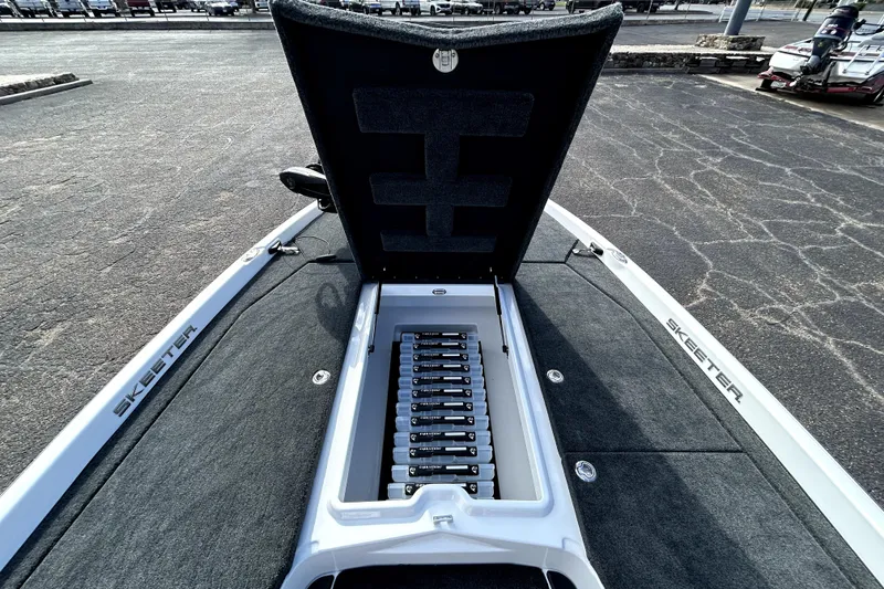 Slide: The Image of 2026 Skeeter ZXE20 boat with open storage compartment, showcasing battery arrangement. - 12