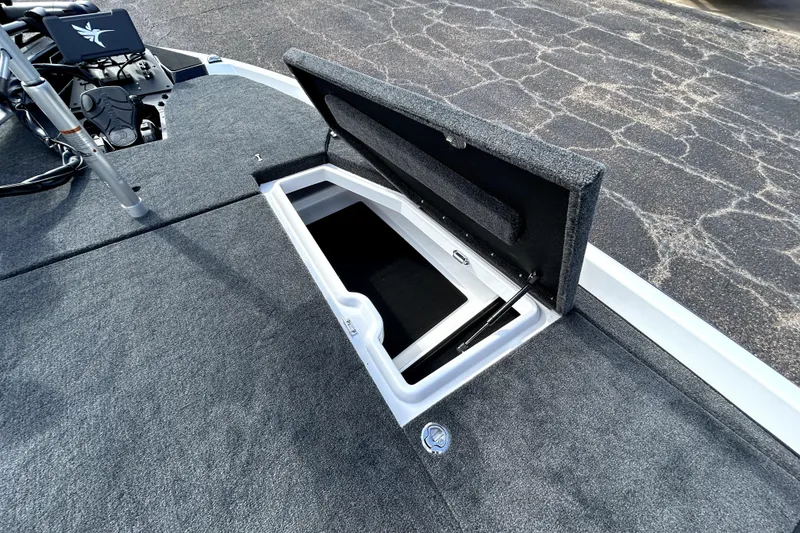Slide: The Image of Open storage compartment on 2026 Skeeter ZXE20 boat deck. - 14
