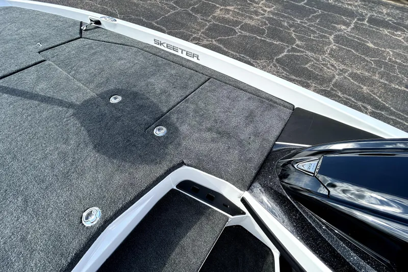 Slide: The Image of 2026 Skeeter ZXE20 boat deck with sleek design and durable carpeting. - 15