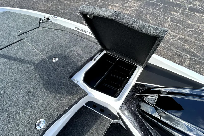 Slide: The Image of 2026 Skeeter ZXE20 boat with open storage compartment on deck. - 16