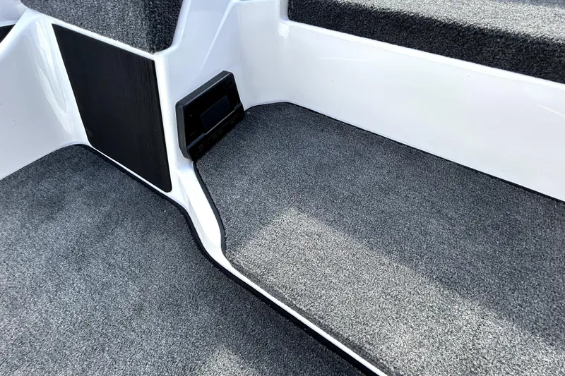 Slide: The Image of Interior of 2026 Skeeter ZXE20 boat with carpeted flooring and sleek design. - 18
