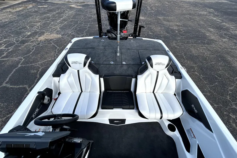 Slide: The Image of 2026 Skeeter ZXE20 boat interior with dual white seats and steering console. - 21