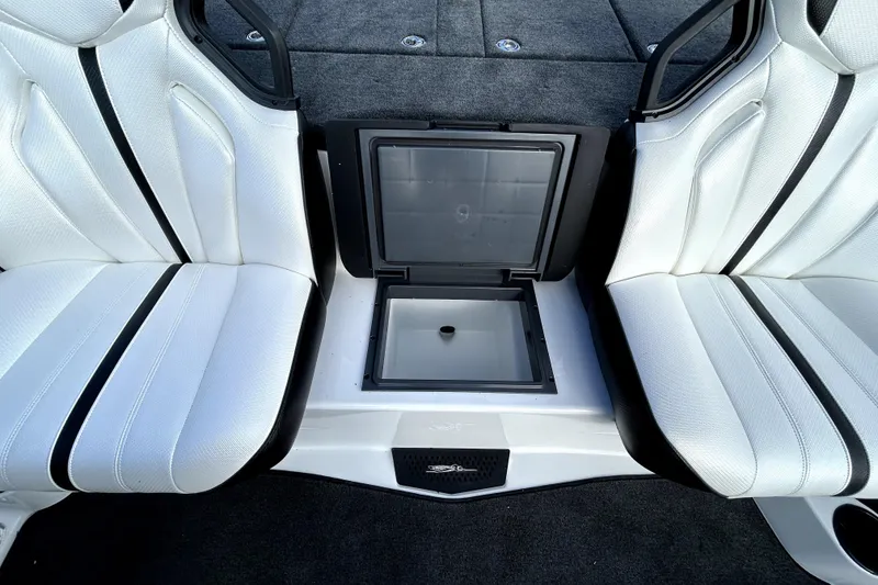 Slide: The Image of 2026 Skeeter ZXE20 interior with white seats and storage compartment. - 23