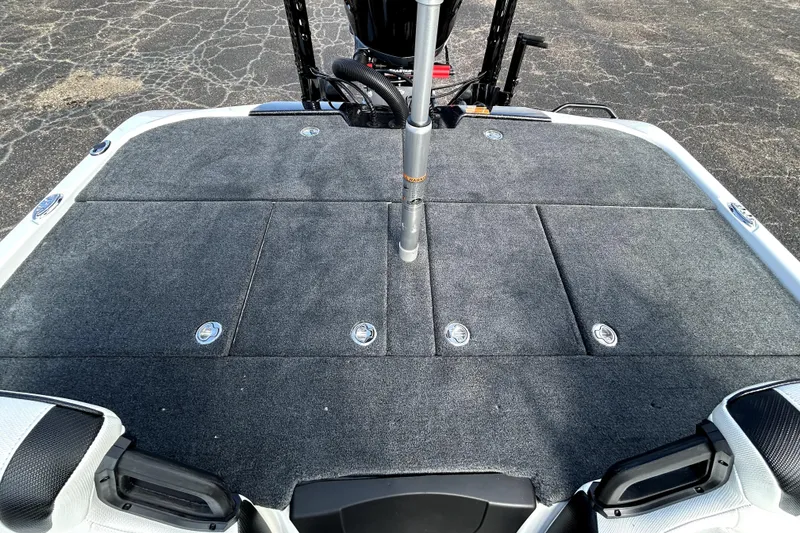 Slide: The Image of 2026 Skeeter ZXE20 boat deck with carpeted surface and storage compartments. - 24