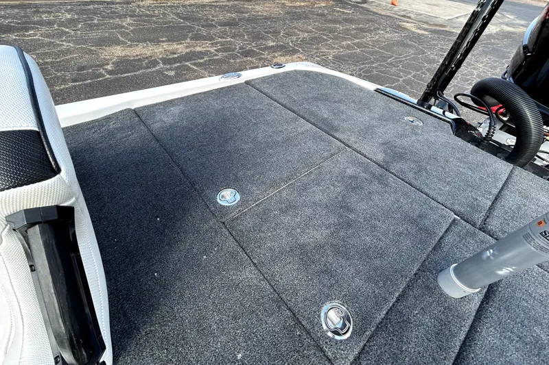 Slide: The Image of 2026 Skeeter ZXE20 boat deck with carpeted surface and storage compartments. - 25