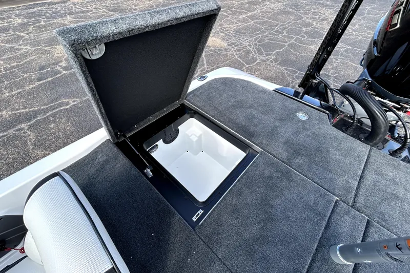 Slide: The Image of Open storage compartment on 2026 Skeeter ZXE20 boat deck, showcasing interior space. - 26