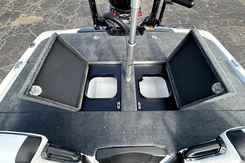Slide: The Image of 2026 Skeeter ZXE20 boat deck with open storage compartments and fishing pole holder. - 28