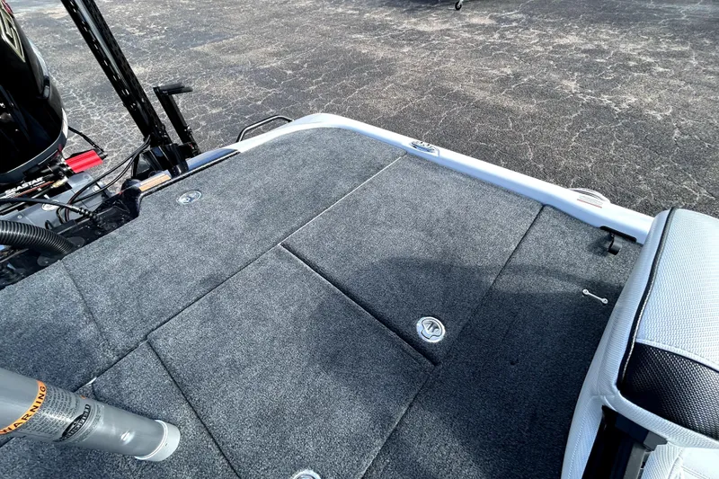 Slide: The Image of 2026 Skeeter ZXE20 boat deck with carpeted surface and storage compartments. - 29