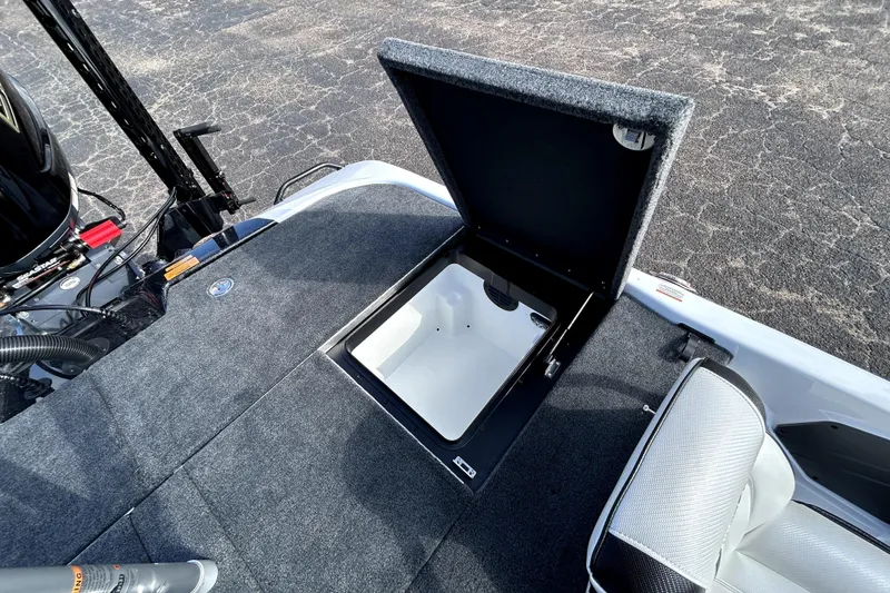 Slide: The Image of 2026 Skeeter ZXE20 boat with open storage compartment on deck. - 30