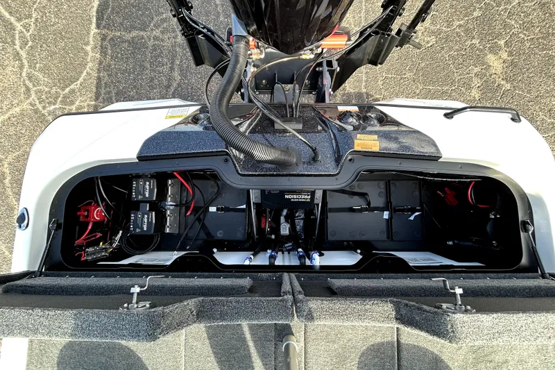 Slide: The Image of 2026 Skeeter ZXE20 boat battery compartment with wiring and components visible. - 31