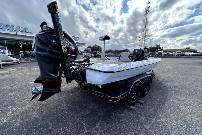 Slide: The Image of 2026 Skeeter ZXE20 boat with powerful outboard motor in a dealership lot. - 6