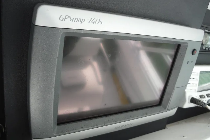 Slide: The Image of Garmin GPSmap 740s on 1999 Intrepid 289 Center Console boat dashboard. - 13