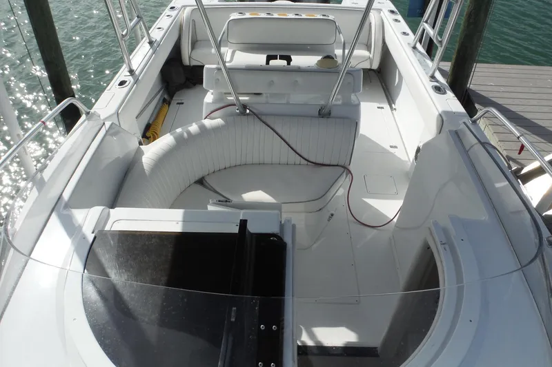 Slide: The Image of 1999 Intrepid 289 Center Console boat interior with seating and open deck. - 21
