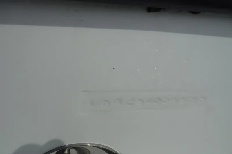 Slide: The Image of Close-up of a 1999 Intrepid 289 Center Console boat hull detail. - 50