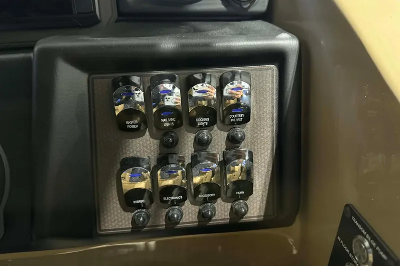 Slide: The Image of Control panel of 2026 Manitou Encore VP 230 with labeled switches. - 12