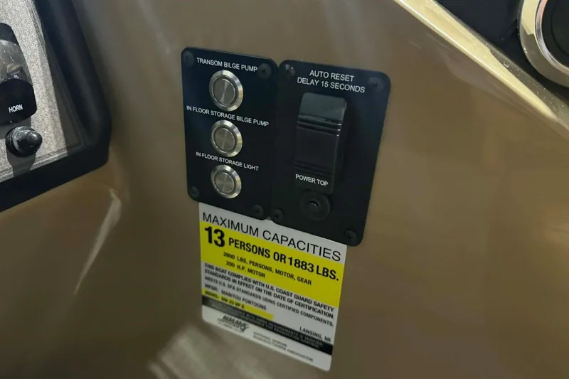 Slide: The Image of Control panel of 2026 Manitou Encore VP 230 with capacity label for 13 persons. - 13