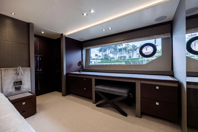 Slide: The Image of Luxurious interior of 2019 Sunseeker 76 yacht with elegant furnishings and large window view. - 103