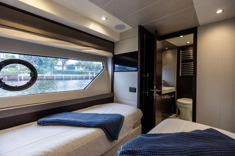 Slide: The Image of Luxurious interior of 2019 Sunseeker 76 yacht with twin beds and en-suite bathroom. - 121